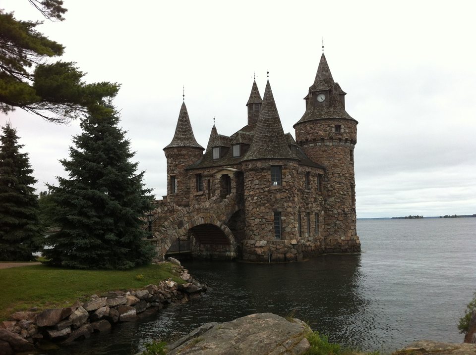 Stone towers of the Boldt Castle power house beside the water in the Thousand Islands