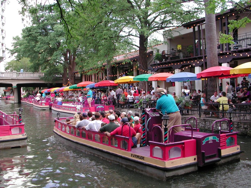 Colorful river boats along the San Antonio River Walk in Texas